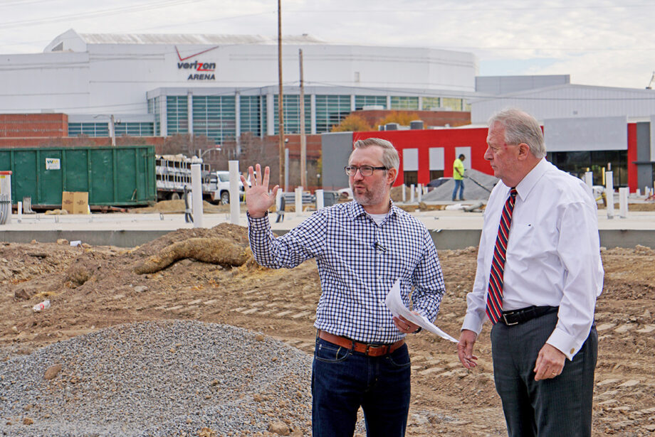Mayor Joe Smith, right, and communications chief Nathan Hamilton look over the Argenta Plaza site, the mayor’s grand vision for downtown.