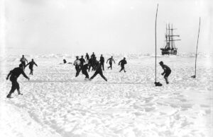 Crewmembers of Ernest Shackleton's Endurance expedition of 1914-1917 play soccer in Antarctica.