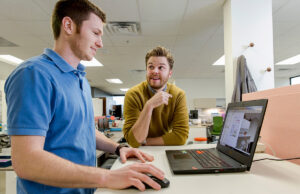 Casey Cerrato, left, and his brother Zac Cerrato, both principals with Evo Business Environments, are using VR software to create files for a factory that makes walls, millwork and other structures.