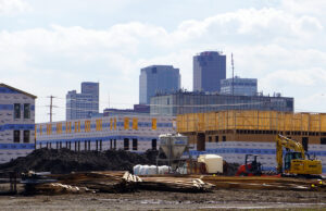 The Thrive Argenta apartments, seen here against the Little Rock skyline, are rising rapidly in North Little Rock.