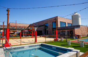 JBGB, which opened in May on Steele Boulevard in Fayetteville, is a 13,000-SF facility featuring corporate offices for Jody Thornton’s JJ’s restaurant operations, a brewery, restaurant and bar and an outdoor stage for musical acts. Volleyball and other outdoor activities are also available.