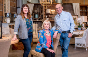 Paul Michael Co. owners Debbie and Paul Michael (center and right), full partners in business and in life, are joined by their daughter, Elizabeth.