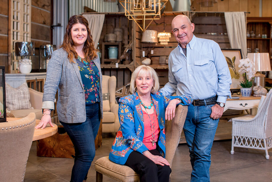 Paul Michael Co. owners Debbie and Paul Michael (center and right), full partners in business and in life, are joined by their daughter, Elizabeth.