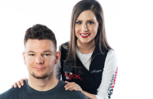 Morgan Furgerson, right, shows off one of her finished products from the Sport Clips Haircuts “The Look” competition.