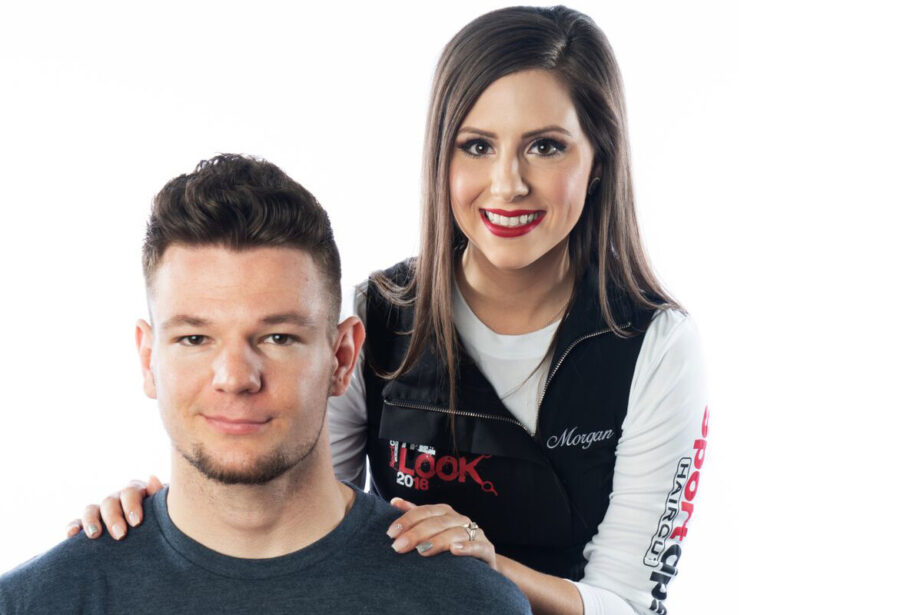 Morgan Furgerson, right, shows off one of her finished products from the Sport Clips Haircuts “The Look” competition.