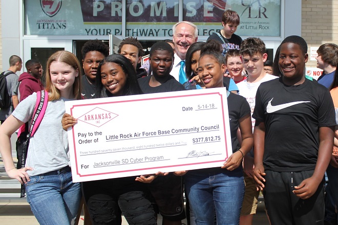 Gov. Asa Hutchinson with students at Jacksonville High School, which received a $377,812 Military Affairs grant to develop a cyber security curriculum with the Little Rock Air Force Base Community Council.