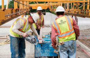 Employees of Manhattan Road & Bridge work on the Cabot North Interchange.