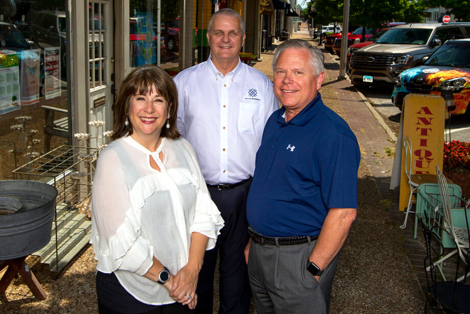 Kelly Hale Syer, executive director of Downtown Springdale, is optimistic about revitalization, along with Springdale Mayor Doug Sprouse, center, and Bill Rogers, an official with the Springdale Chamber of Commerce. They are seen here on Emma Street, the backbone of the city&rsquo;s Downtown Master Plan.