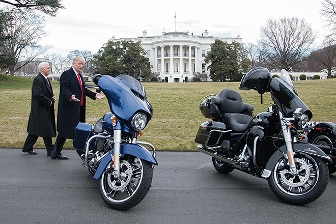 President Donald Trump and Vice President Mike Pence admire several Harley-Davidson bikes on the South Lawn driveway of the White House in Washington, D.C. during the adminstration's first month in office.