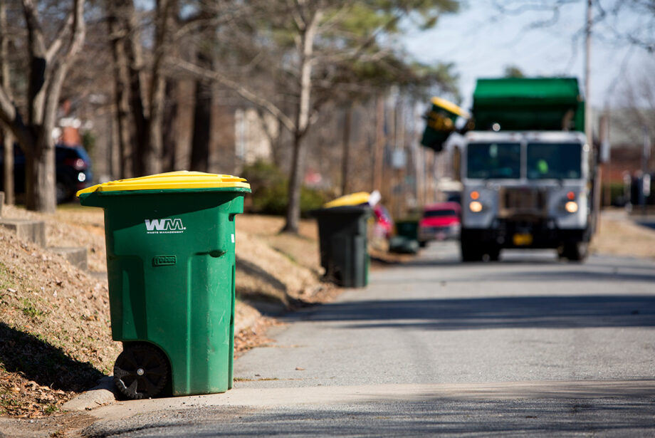 A Waste Management truck picks up waste for recycling in North Little Rock.