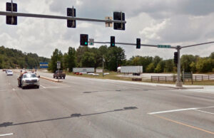 Looking south, traffic on U.S. Highway 71 travels over the state line into Arkansas – but not before proceeding through yet another traffic light.
