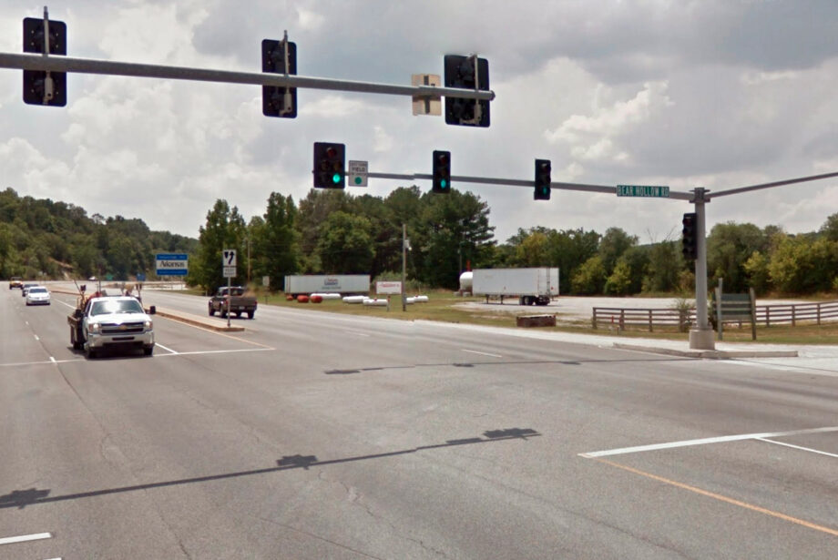 Looking south, traffic on U.S. Highway 71 travels over the state line into Arkansas – but not before proceeding through yet another traffic light.