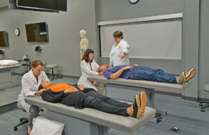 Doctors demonstrate osteopathic techniques in a high-tech training center at the New York Institute of Technology College of Osteopathic Medicine in Wilson Hall on the campus of Arkansas State University in Jonesboro.