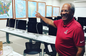 Professor Gerald Jordan in the new converged newsroom of the University of Arkansas’ fully accredited School of Journalism and Strategic Media, which has new facilities to go with its new name.