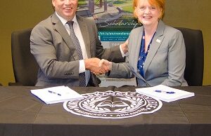 Randy Esters, Ph.D., president of North Arkansas College, and Robin E. Bowen, Ph.D., president of Arkansas Tech University sign the memorandum of understanding on Sept. 11.&nbsp;