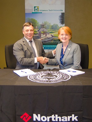 Randy Esters, Ph.D., president of North Arkansas College, and Robin E. Bowen, Ph.D., president of Arkansas Tech University sign the memorandum of understanding on Sept. 11.&nbsp;