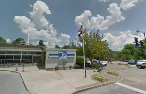 The U.S. Post Office at 12 W. Dickson St. in Fayetteville. The steeple Central United Methodist Church can be seen in the background.