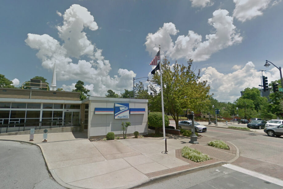 The U.S. Post Office at 12 W. Dickson St. in Fayetteville. The steeple Central United Methodist Church can be seen in the background.