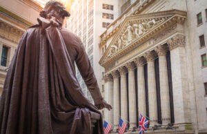 A statue of George Washington looks over the New York Exchange (NYSE) building on Wall Street.