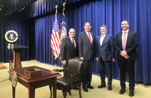 Farm Bureau President Randy Veach, U.S. Sen. John Boozman, Farm Bureau Board Member Terry Dabbs and Matt King, Farm Bureau director of public affairs and government relations, stand onstage before the signing ceremony of the 2018 Farm Bill in Washington, D.C.