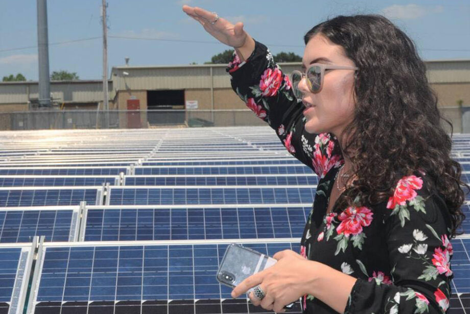 Jennah Denney, marketing coordinator for Today's Power Inc., at one of the utility-scale solar arrays the company has built around Arkansas and beyond.