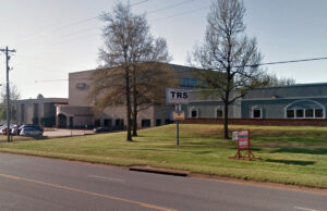 The former headquarters for The Right Solutions (TRS) was bought by its next-door neighbor, PAM Transport Services Inc. of Tontitown.