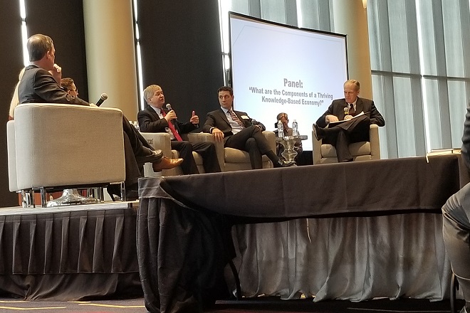 Dr. Richard Brown, dean of the College of Engineer at the Univeristy of Utah, speaks Tuesday during a panel at the first-ever Arkansas Innovation Council Summit in the Robinson Center's ballroom in Little Rock.