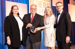 David Avery, vice president of corporate affairs for Windstream Holdings Inc. of Little Rock, accepts the inaugural Olivia Farrell Gender Equity Leadership award from the Women's Foundation of Arkansas. He is joined by Farrell (left); Anna Beth Gorman, executive director of the Women's Foundation; and Mitch Bettis, publisher of Arkansas Business.