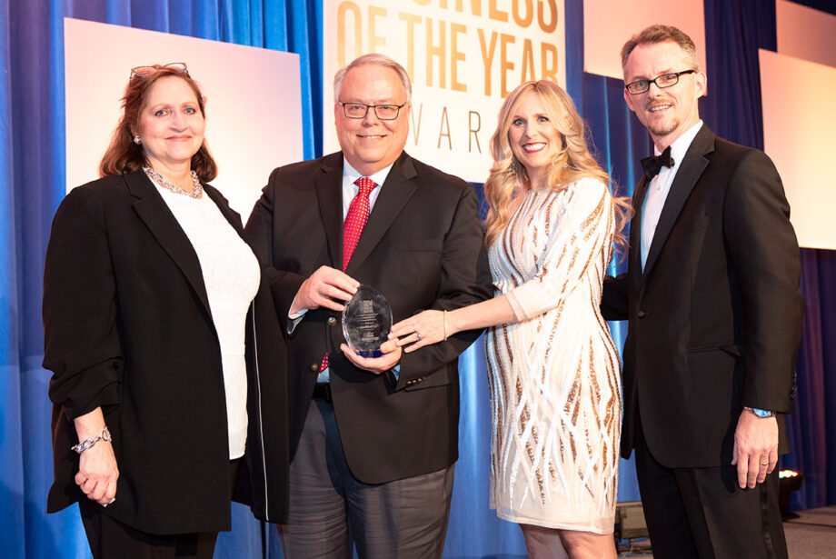 David Avery, vice president of corporate affairs for Windstream Holdings Inc. of Little Rock, accepts the inaugural Olivia Farrell Gender Equity Leadership award from the Women's Foundation of Arkansas. He is joined by Farrell (left); Anna Beth Gorman, executive director of the Women's Foundation; and Mitch Bettis, publisher of Arkansas Business.