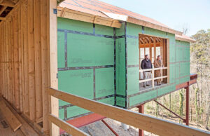 Cori Catlett and his father, Leon, admires the view from the home Cori is building at the top of Cantrell Hill in the Heights neighborhood of Little Rock.