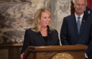 Aerojet Rocketdyne CEO Eileen Drake&nbsp;with Gov. Asa Hutchinson in 2018, announcing an expansion at the company's facility in East Camden.