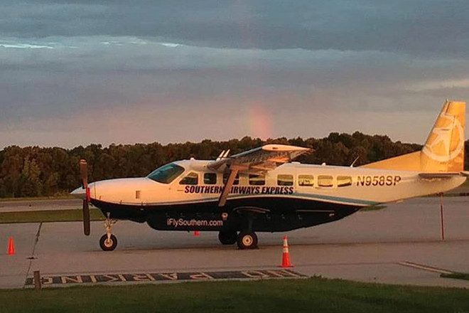 A Southern Airways Express airplane on the ground at Boone County Regional Airport.
