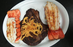 Bone’s Chophouse focuses on hand-cut steaks, pork chops and seafood like lobster tails.