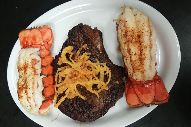 Bone’s Chophouse focuses on hand-cut steaks, pork chops and seafood like lobster tails.