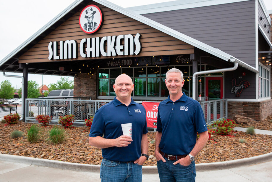 Tom Gordon, left, and Greg Smart shared a vision in founding restaurant chain  Slim Chickens of Fayetteville: “The vision was always to have a big company,” said Gordon.  The pair are shown at a new location in Springdale.