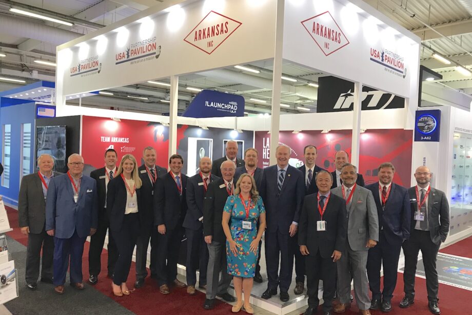 Arkansas' delegation to the 2019 Paris Air Show poses for a photo at the Arkansas booth. The group includes Gov. Asa Hutchinson and Mike Preston, executive director of the Arkansas Economic Development Commission.