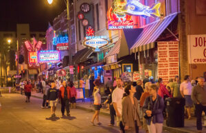 Some Arkansas cities are taking steps to establish entertainment districts in which open containers of alcoholic beverages are allowed on public streets, similar to the Beale Street District in Memphis, shown above.