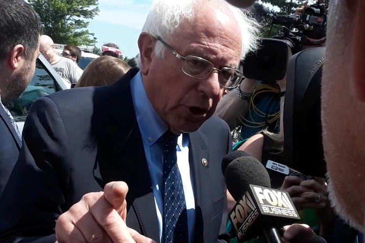 U.S. Sen. Bernie Sanders (I-Vermont) speaks to reporters in Rogers after presenting a proposal at Wednesday's Walmart Inc. business meeting.