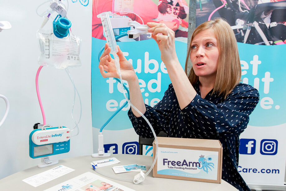Misti Staley demonstrates her new medical device, the FreeArm, which can hold a bolus syringe, up to 500 ml of volume and a small pump.
