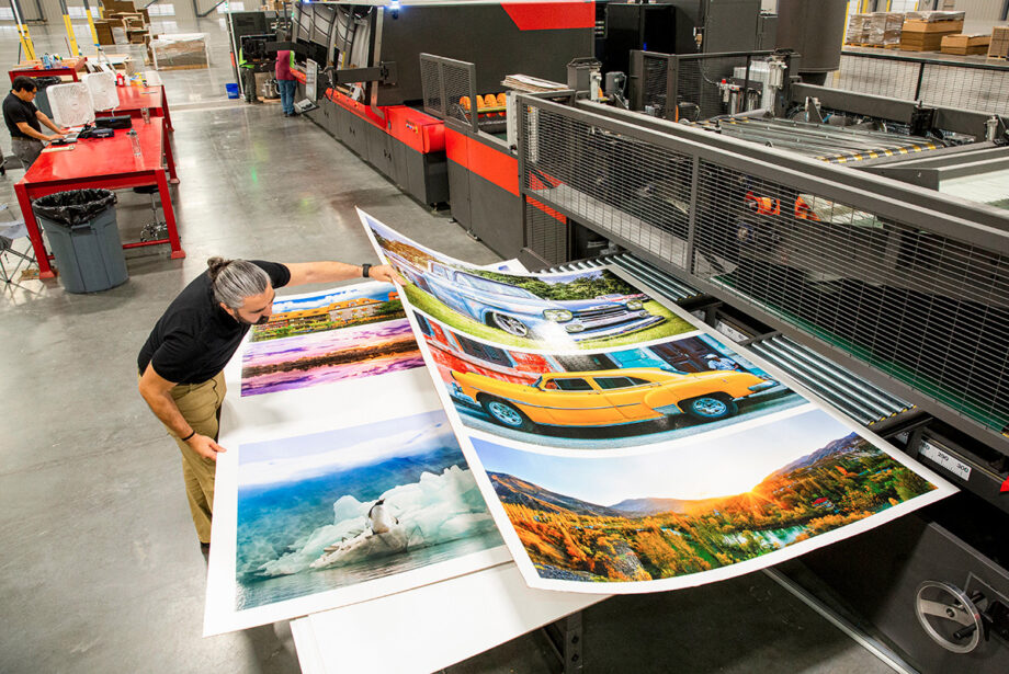 Justin Best of Precision Digital Printing of Jonesboro checks color quality from the Nozomi C18000 press.  Lamb & Associates Packaging of Maumelle has a similar cutting-edge machine.