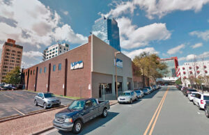 The former home of the VCC general contracting firm is marked for proposed redevelopment as a parking lot, along with two neighboring office buildings.