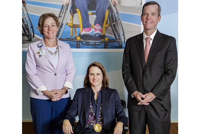 From left, Marcy Doderer, president and CEO of Arkansas Children&rsquo;s Hospital;&nbsp;Dr. Jill Fussell, chair holder of the Harvey and Bernice Jones Endowed Chair in Developmental Pediatrics; and UAMS Chancellor Dr. Cam Patterson.