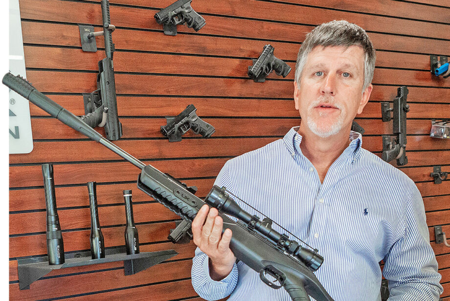 Adam Blalock, CEO of Umarex/Walther, holds one of his company’s high-powered air rifles at its corporate headquarters in Fort Smith.