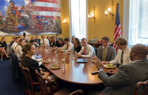 Sen. Tim Scott (back to camera), R-S.C., lunches with congressional interns at the U.S. Capitol July 17.
