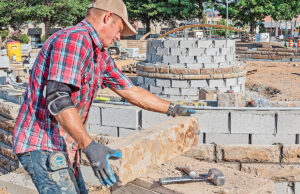 James Ibison with Ibison Masons prepares to cut a decorative stone for Gateway Park at the east entrance of downtown Fort Smith.