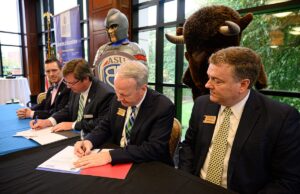 From left, W. Richard Counts, associate vice chancellor of academics at ASU-Beebe; Jason Goodner, chief academic officer at ASU-Beebe; Bruce McLarty, president at Harding University; and Marty Spears, provost and&nbsp; chief academic officer at Harding University sign the MOU on Friday at Harding.&nbsp;&nbsp;