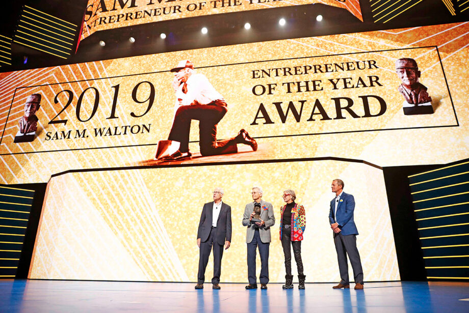 Rob Walton, Jim Walton, Alice Walton and Greg Penner presenting the Entrepreneur of the Year award at the 2019 Walmart shareholders meeting June 7 at Bud Walton Arena.
