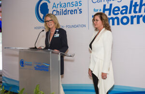 Arkansas Children's Foundation board members Lynn Parker (left) and Kim Fowler announce $2.5 million in donations in Jonesboro.