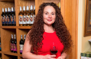 Audrey House, with Chateau Aux Arc, stands in the tasting room at her vineyard.