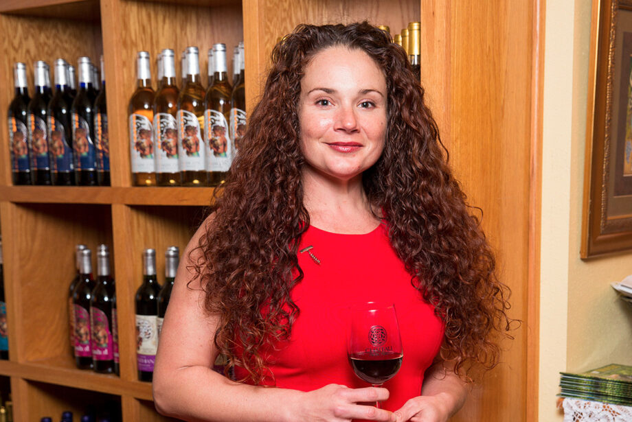 Audrey House, with Chateau Aux Arc, stands in the tasting room at her vineyard.